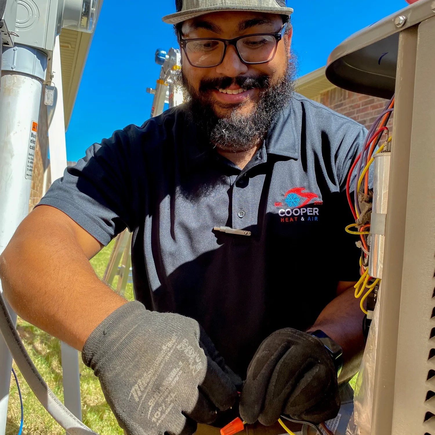 Multiple outdoor air conditioning units lined up on a rooftop, providing cooling for a commercial building